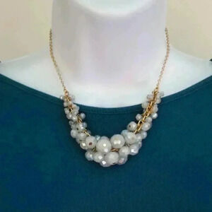 Adjustable gold tone necklace with faceted beads